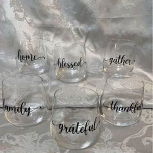 One complete set of 6 stemless wine glasses embellished with for the season!